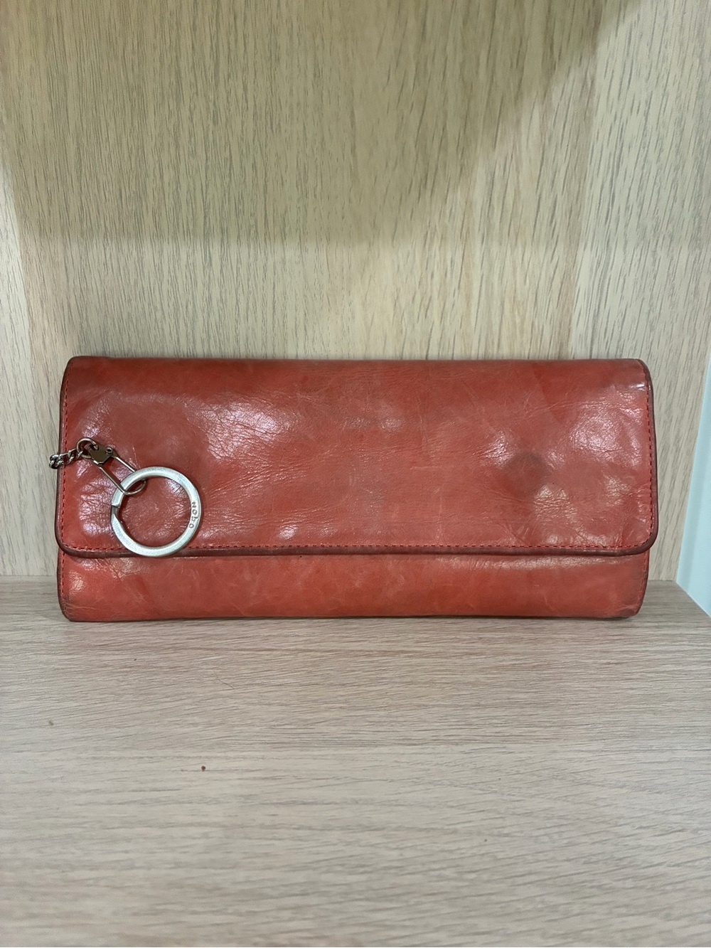 HOBO Leather Fold-Over Clutch Wallet in Rust Orange with Silver Ring